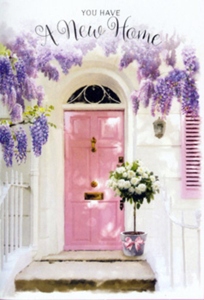 The scene unfolds in front of a quaint home you might find near the peaceful residential streets of Sipson, where gardens are carefully tended and neighbours greet each other by name. A pale pink front door commands the centre of the image, its colour soft yet confident, like a brushstroke of warmth against the whitewashed walls that surround it. A single shutter, painted in a harmonising pastel shade, leans open as if inviting light and fresh air in from the leafy roads that lead towards Harmondsworth and the nearby green spaces. Arcing above the doorway, mature wisteria trails down in long, pendulous garlands of lavender and lilac blooms. The clusters are thick and tumbling, creating textured curtains that sway slightly in the imagined breeze. Their fragrance seems almost audible, a powdery, floral sweetness that could easily drift along the quiet pavements of Sipson on a spring afternoon. At the doorstep sits a stylish, slightly weathered metal bucket, its gentle grey finish providing an understated counterpoint to the romantic colours above. Inside, an abundant bouquet of white and cream roses rises in a rounded, carefully balanced display. Each rose is full and layered, their petals curling softly at the edges like folded satin. Wisps of fresh green foliage nestle between the blooms, adding depth and a freshly-picked charm. Around the bucket, a pink satin ribbon ties everything together, its sheen catching stray rays of sun. The overall mood is one of tender excitement and calm reassurance-a floristry moment that speaks of moving in, making memories, and offering heartfelt congratulations to someone beginning their story in a new Sipson home.